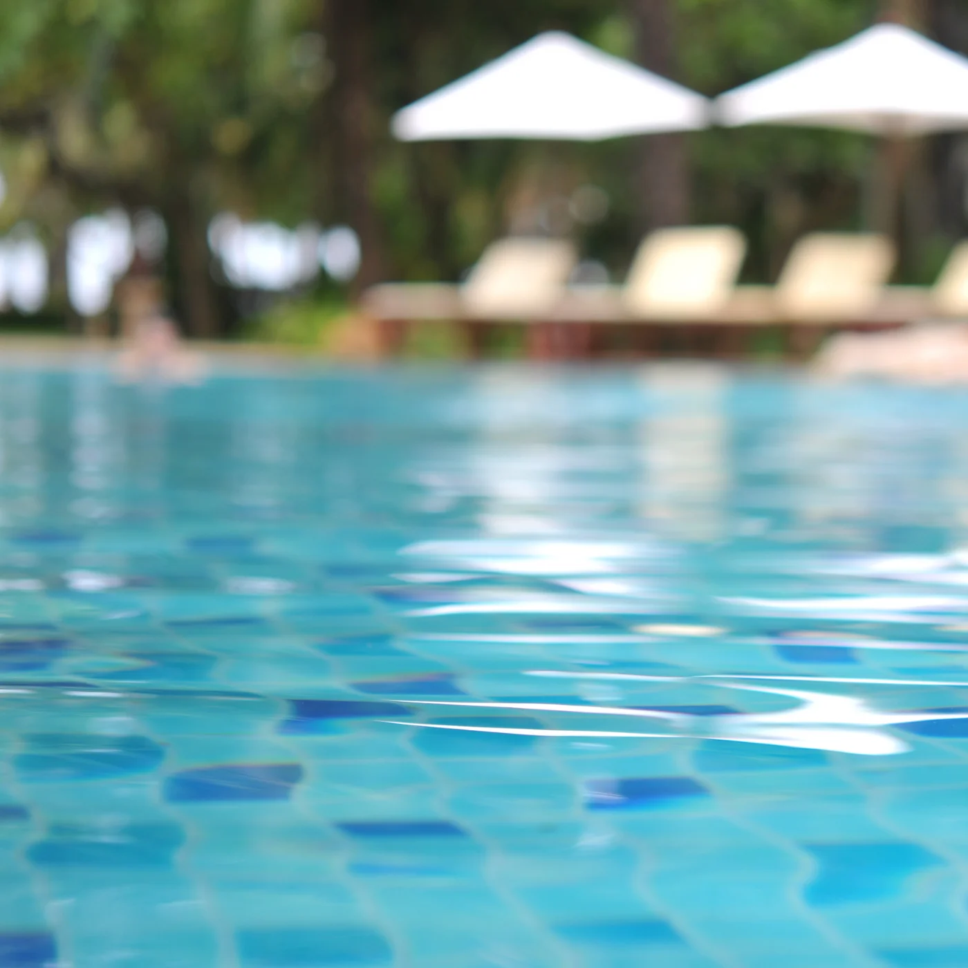 Crystal-clear pool water ready for weekly full-service cleaning